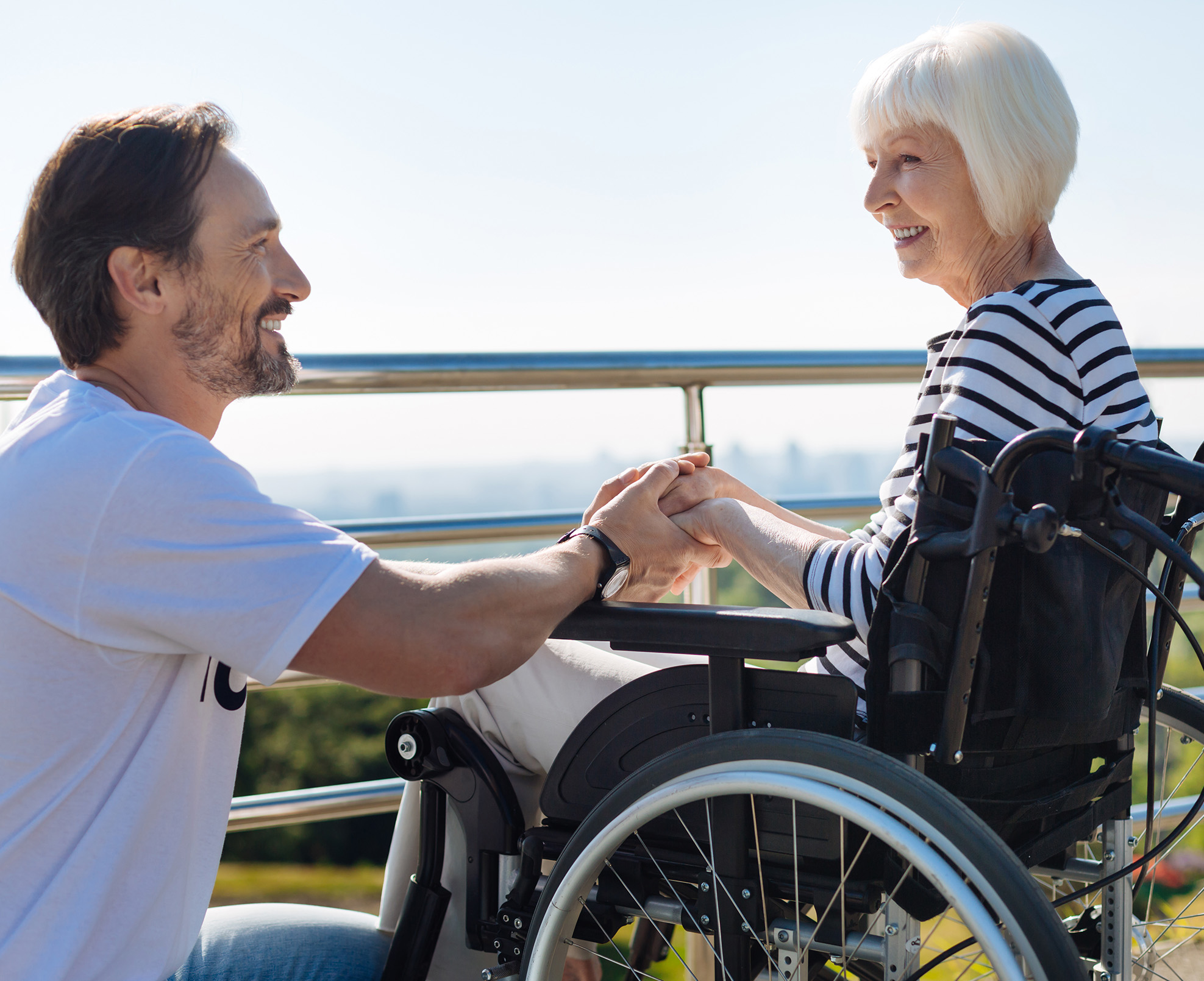 Man holding older womans hand